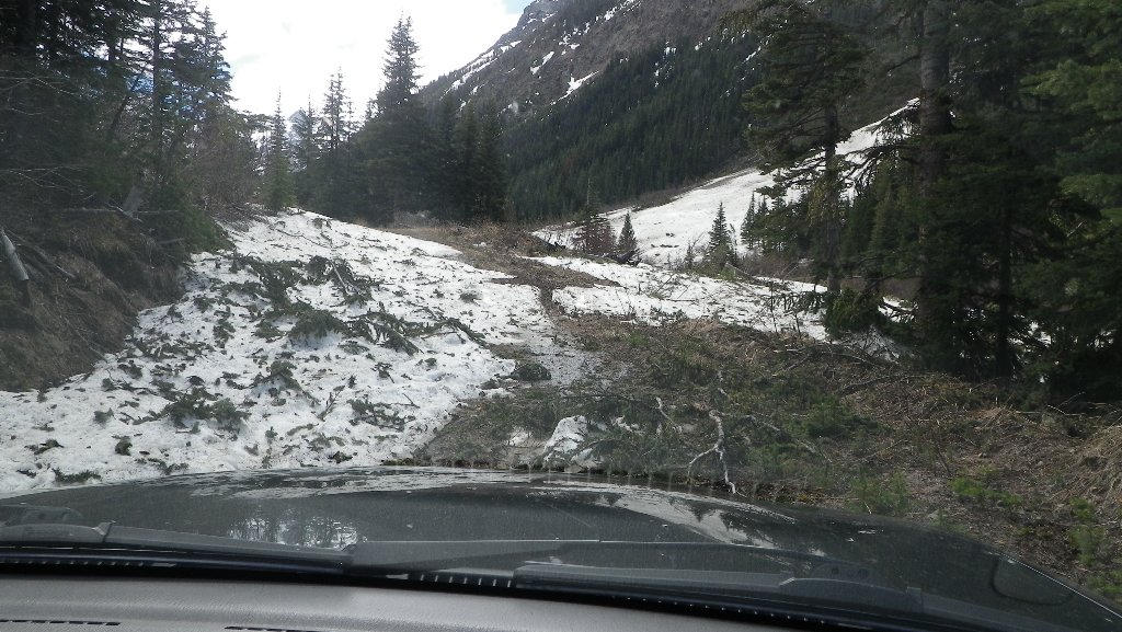 EDGE OF AVALANCHE CHUTE ON ROAD