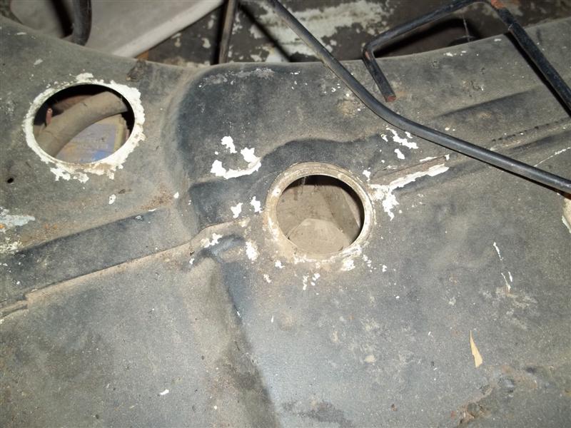 Mustache bar stud hole in trunk under gas tank.