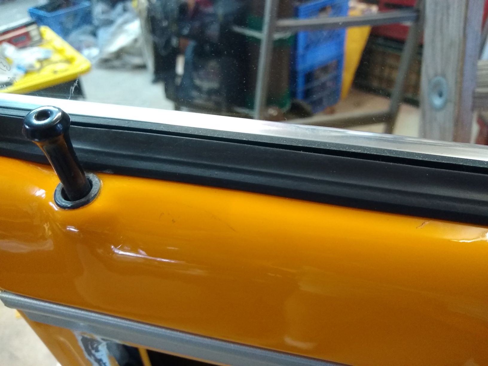 Inner squeegee with window rolled up (inner flange pivots  up with lower glass support)